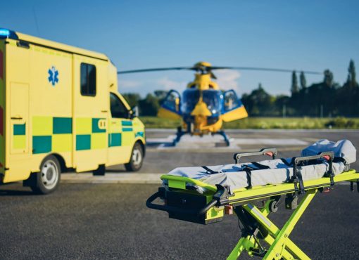 Stretcher,Against,Ambulance,Car,And,Helicopter,Of,Emergency,Medical,Service.